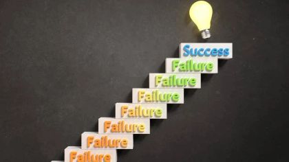 Staircase with blocks labeled "Success" at the top and "Failure" below, leading to a light bulb.